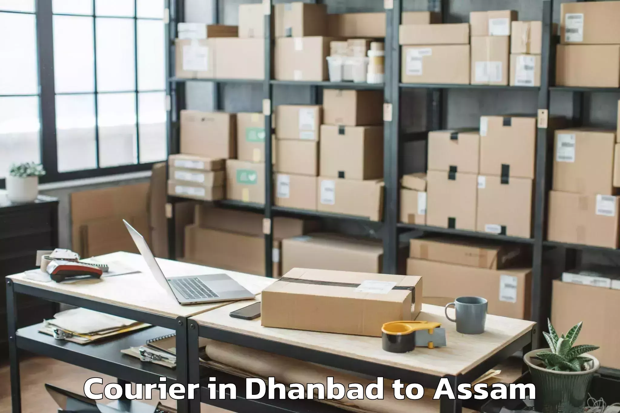 Quality Dhanbad to Pachim Nalbari Courier